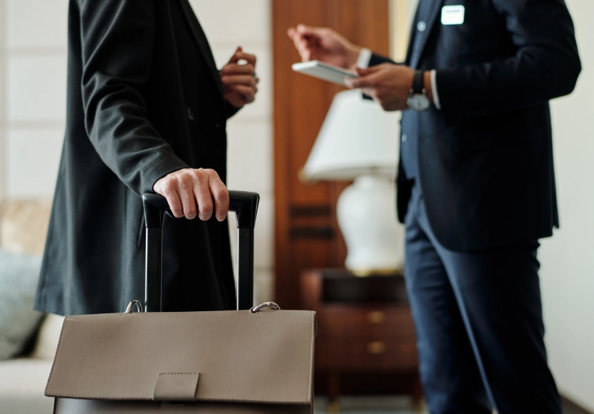 Business person checking into hotel.